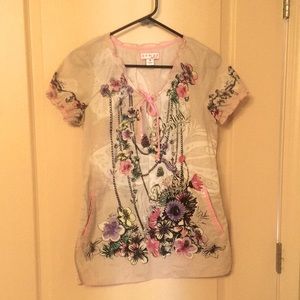 Uniform top by Koi. Unique design with ruffled neck line and sleeves.